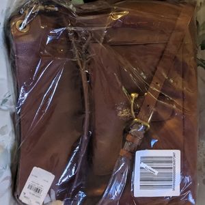 Coach pebble tabby hobo.  Saddle color.